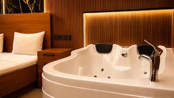 Deluxe Double Room, Jetted Tub | Bathroom | Designer toiletries, hair dryer, slippers, bidet