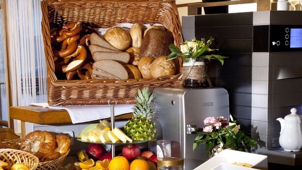 A buffet with various food items including meats, cheeses, fruits, and breads. - Bimesmeier Gasthof & Pension (Koesslarn)