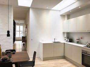 Luxury Apartment | Private kitchen | Full-size fridge, oven, stovetop, dishwasher