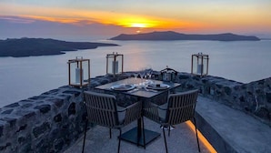 A table set for dining with a sunset view. - Villa Bordeaux (Santorini)