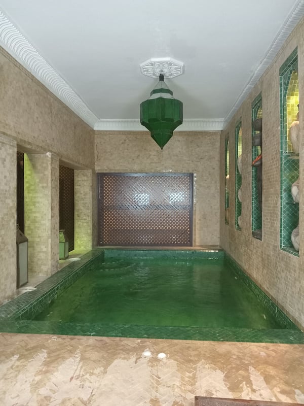 Outdoor pool, open 11 AM to 7 PM, pool umbrellas, pool loungers