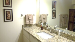 Combined shower/tub, hair dryer, towels, soap