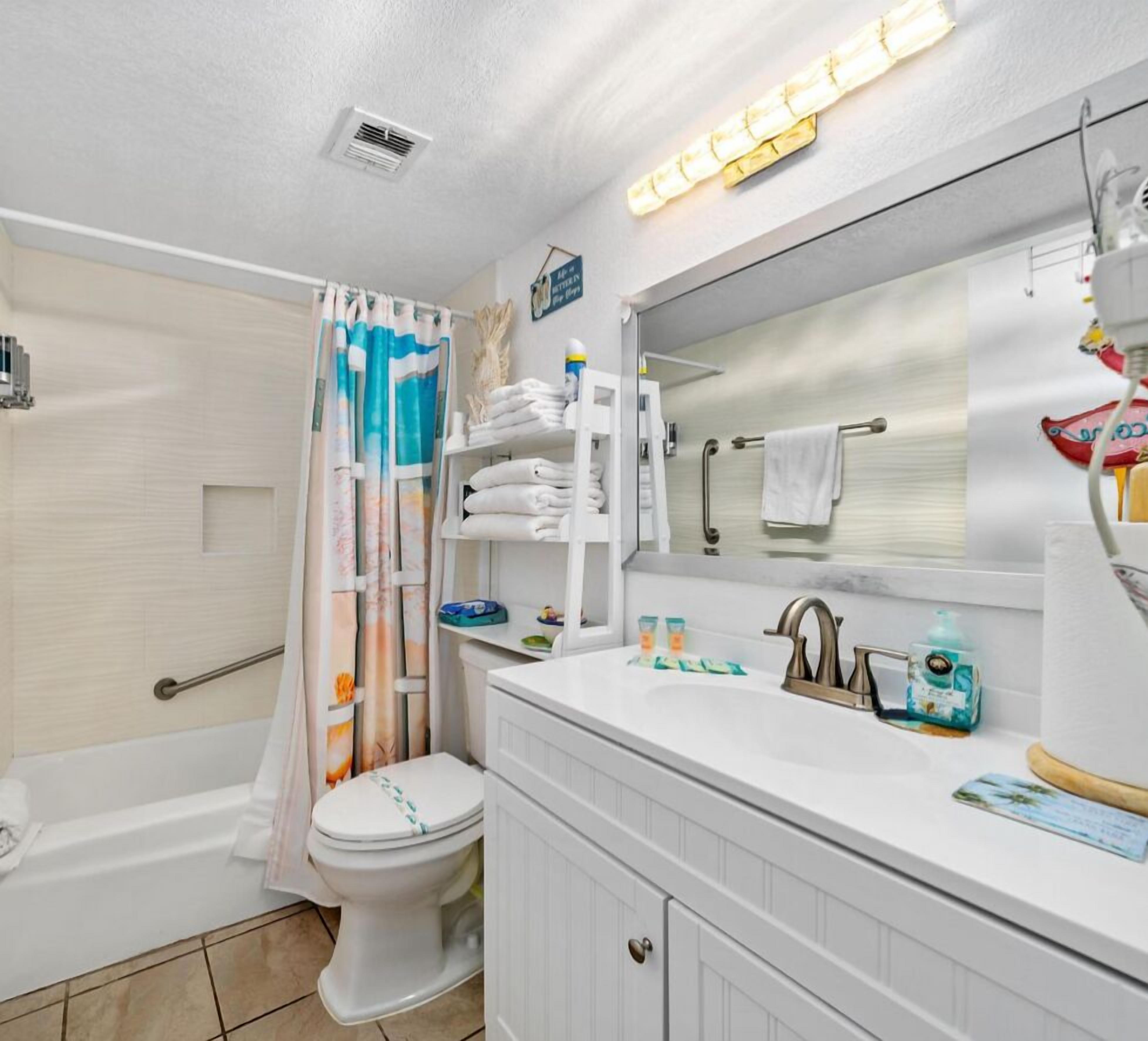 Combined shower/tub, hair dryer, towels, soap