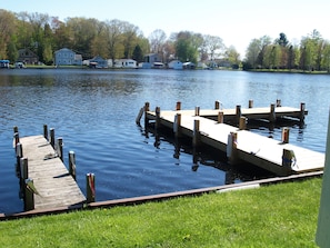 Guests can enjoy a serene lakeside setting with a dock extending into the water.