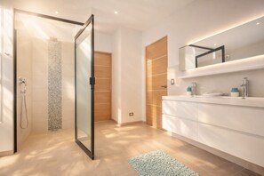 Shower, hair dryer, towels, soap