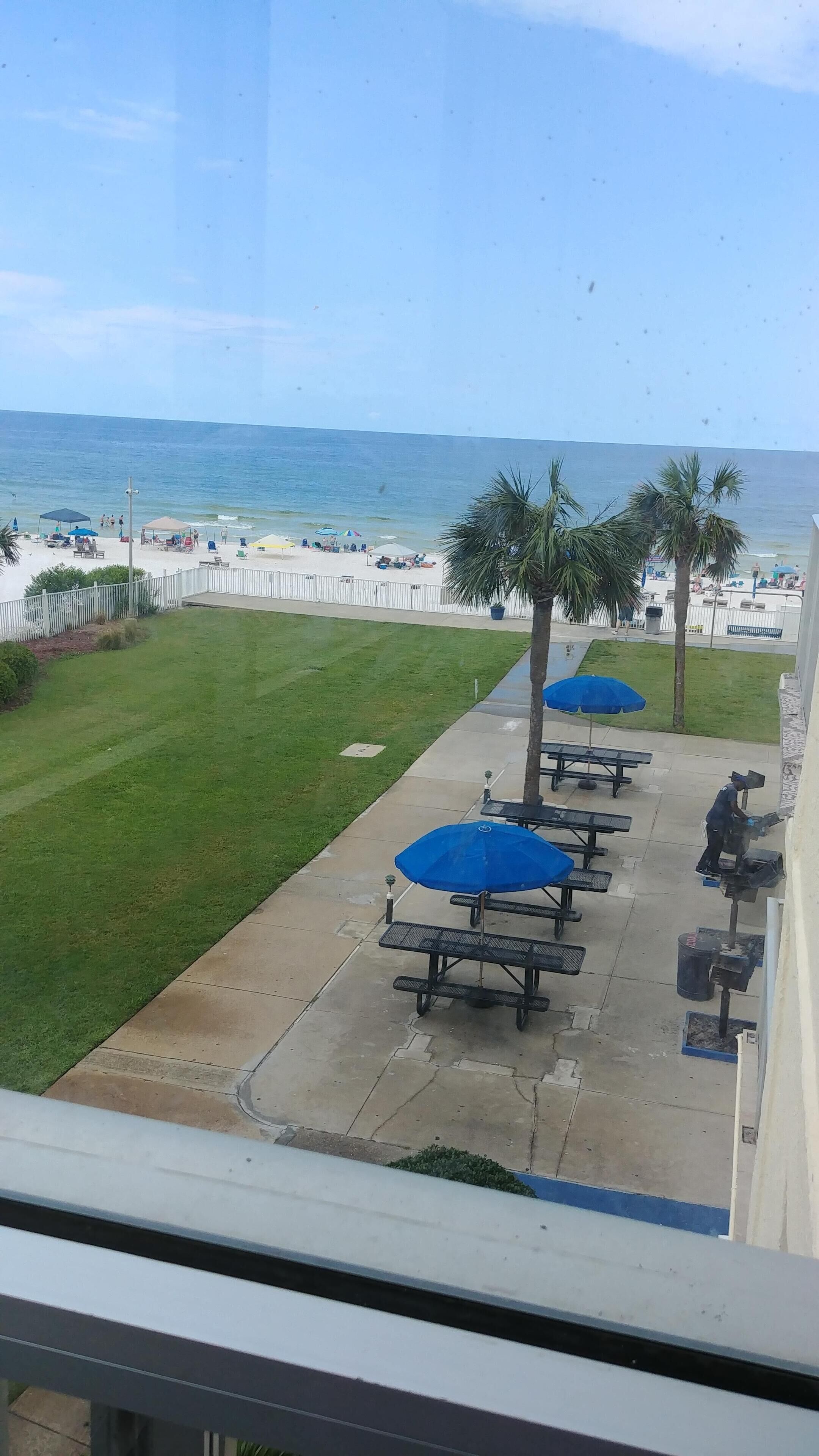 grill and picnic area with new tables and umbrellas as viewed from my balcony.