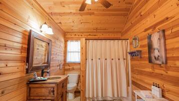 Combined shower/bathtub, hair dryer, towels, soap
