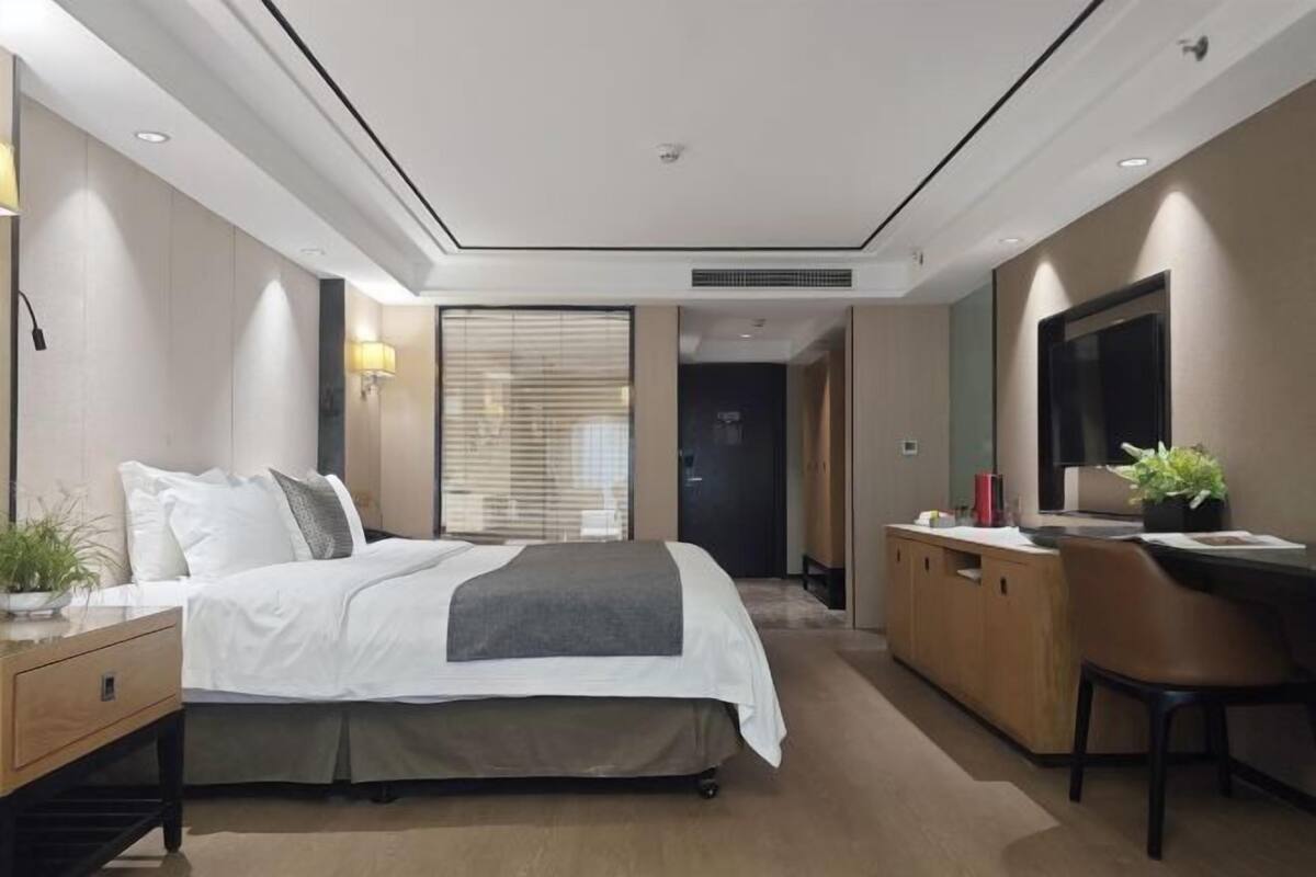 Premium bedding, desk, laptop workspace, blackout curtains