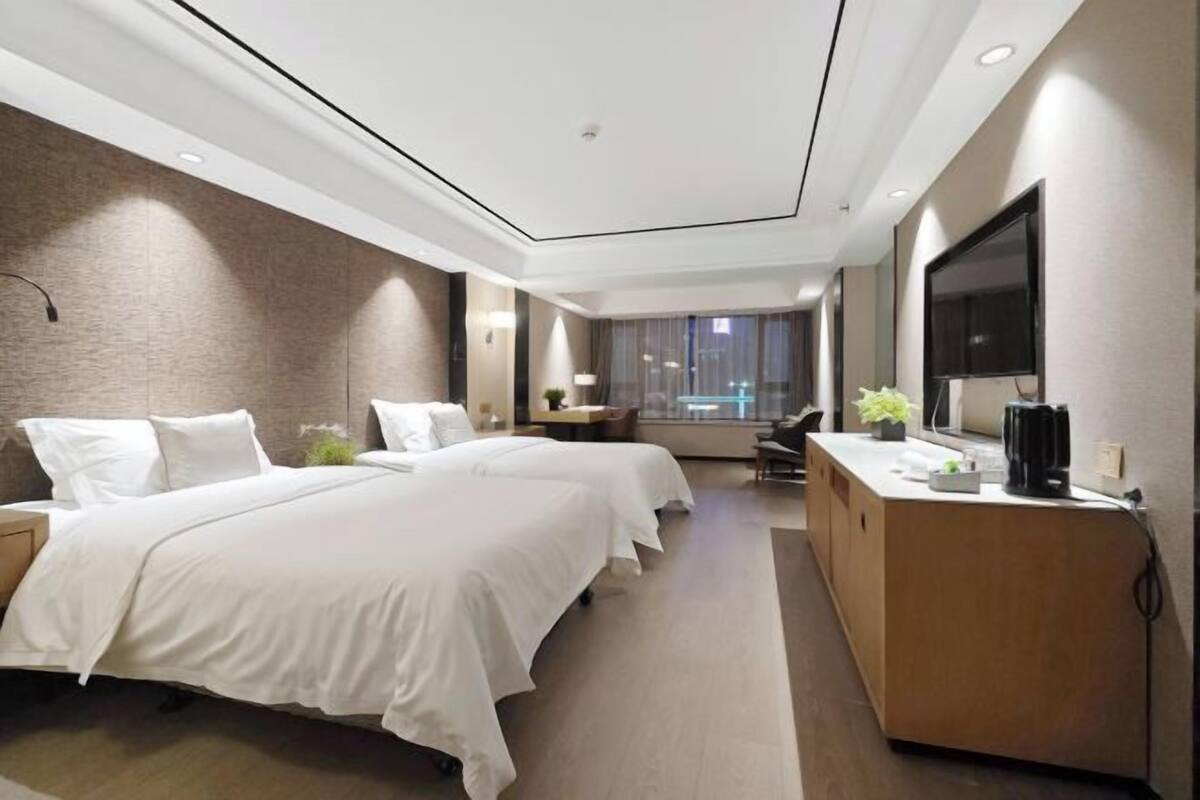 Premium bedding, desk, laptop workspace, blackout curtains