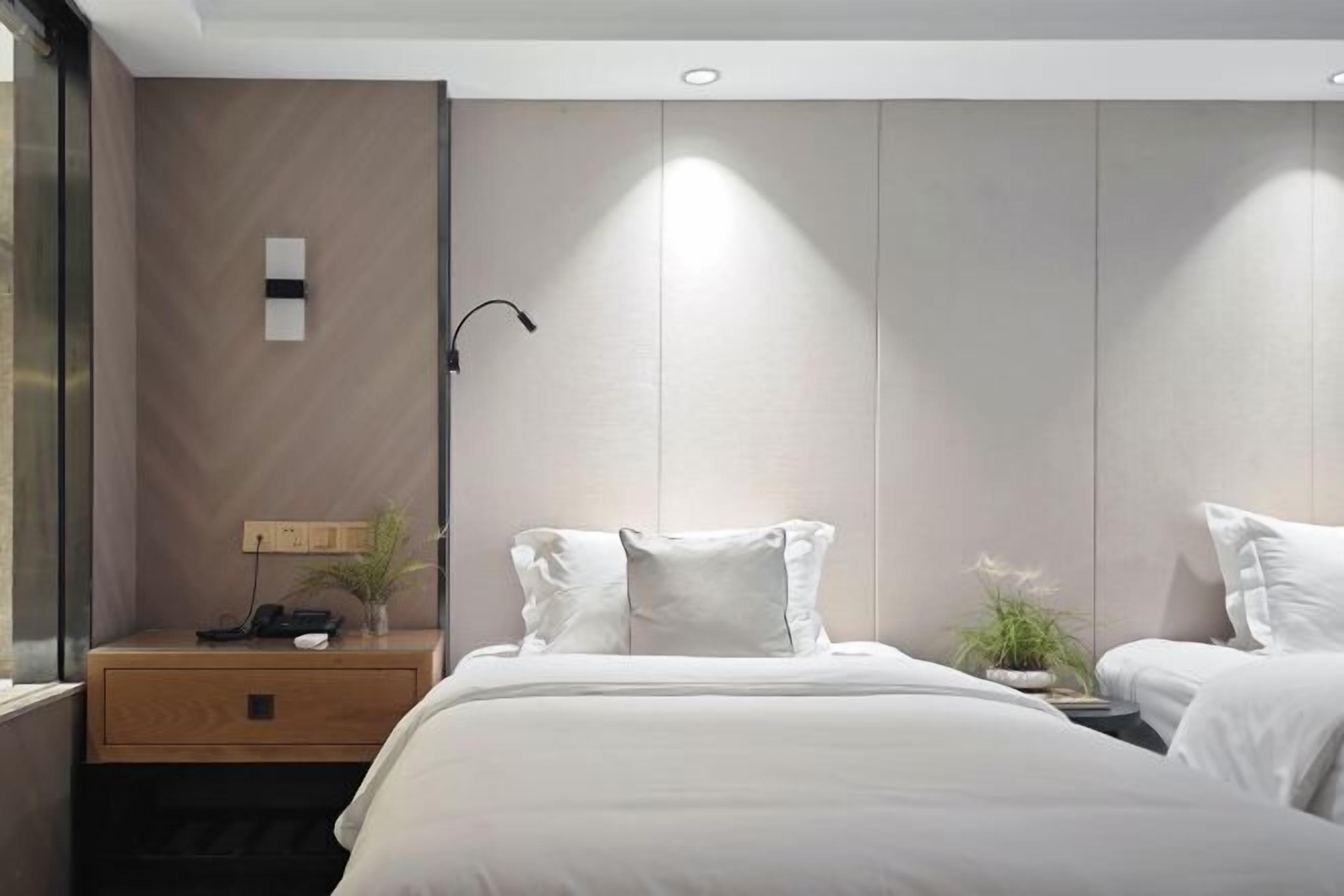 Premium bedding, desk, laptop workspace, blackout drapes