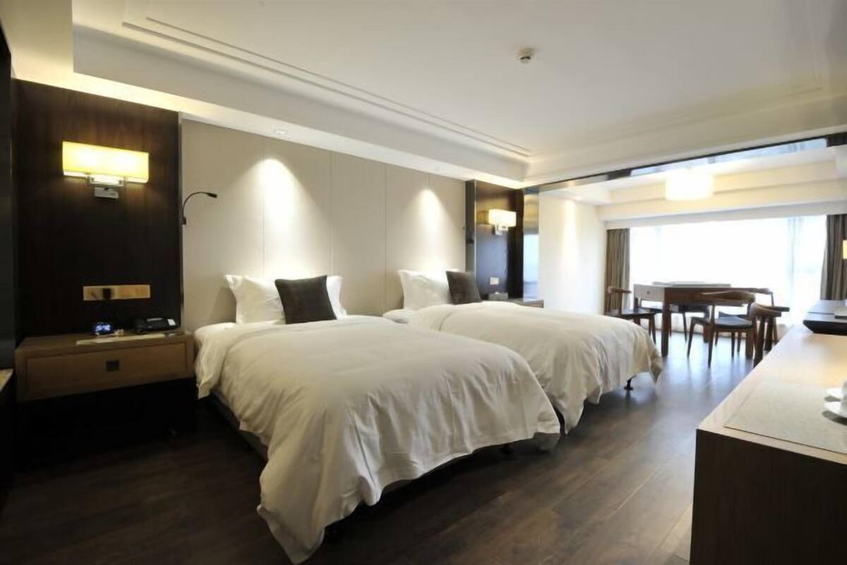 Premium bedding, desk, laptop workspace, blackout curtains