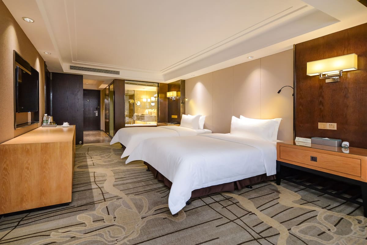 Premium bedding, desk, laptop workspace, blackout drapes