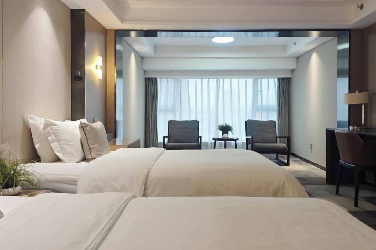 Premium bedding, desk, laptop workspace, blackout curtains