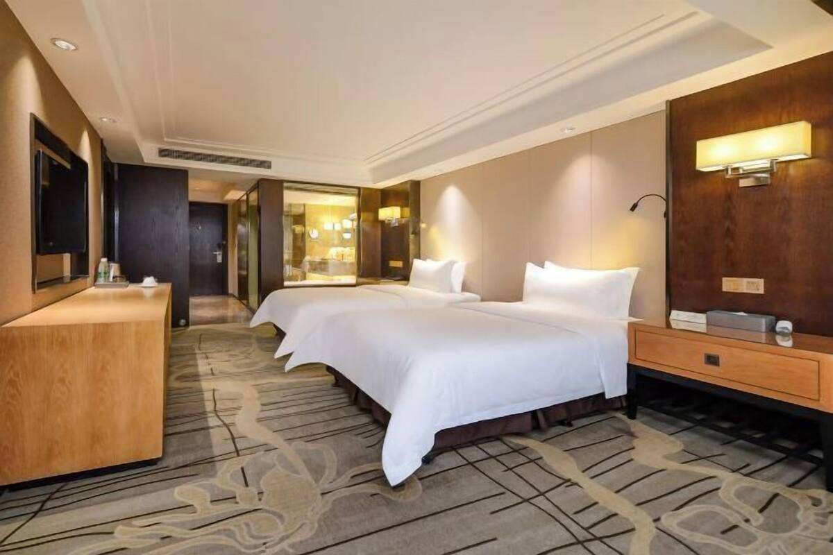 Premium bedding, desk, laptop workspace, blackout curtains