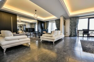 Royal Suite, 1 Queen Bed with Sofa bed, Jetted Tub | Living room | LCD TV