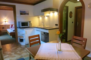 Apartment, 1 Bedroom, Balcony, Mountain View | Private kitchen | Fridge, microwave, oven, stovetop - Ferienwohnungen Hinteranger (Tux)