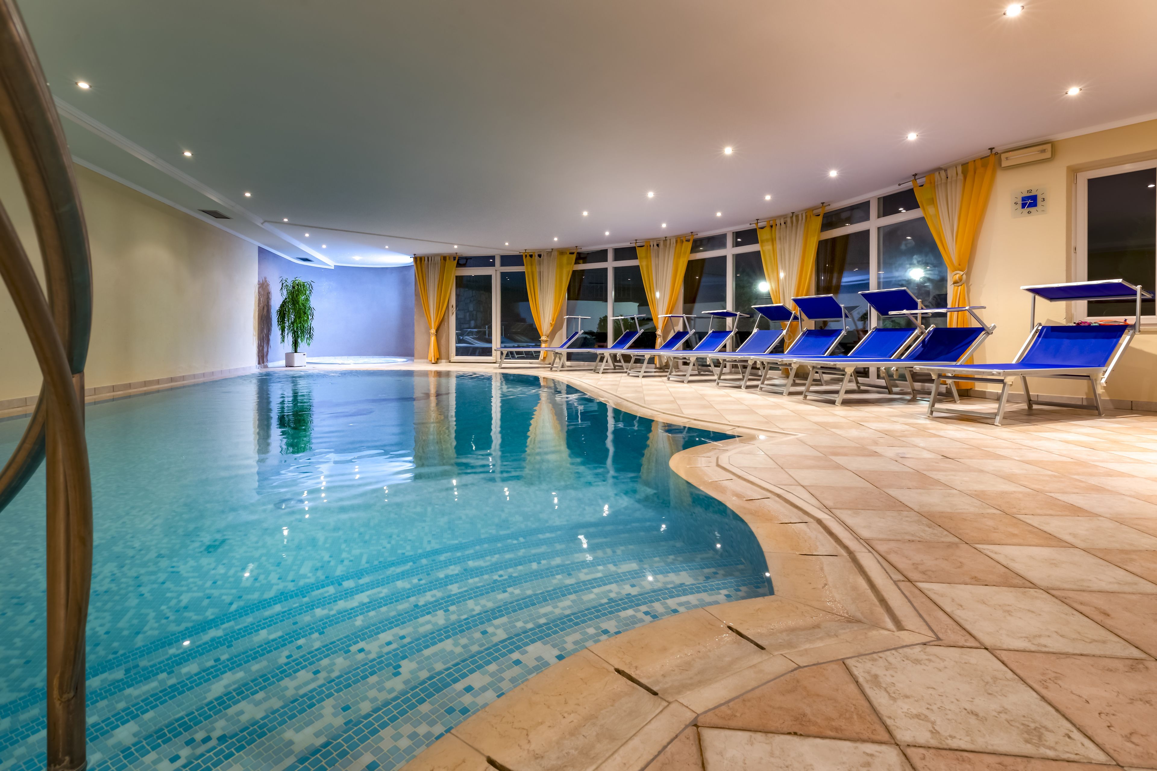 indoor pool, pool umbrellas, pool loungers