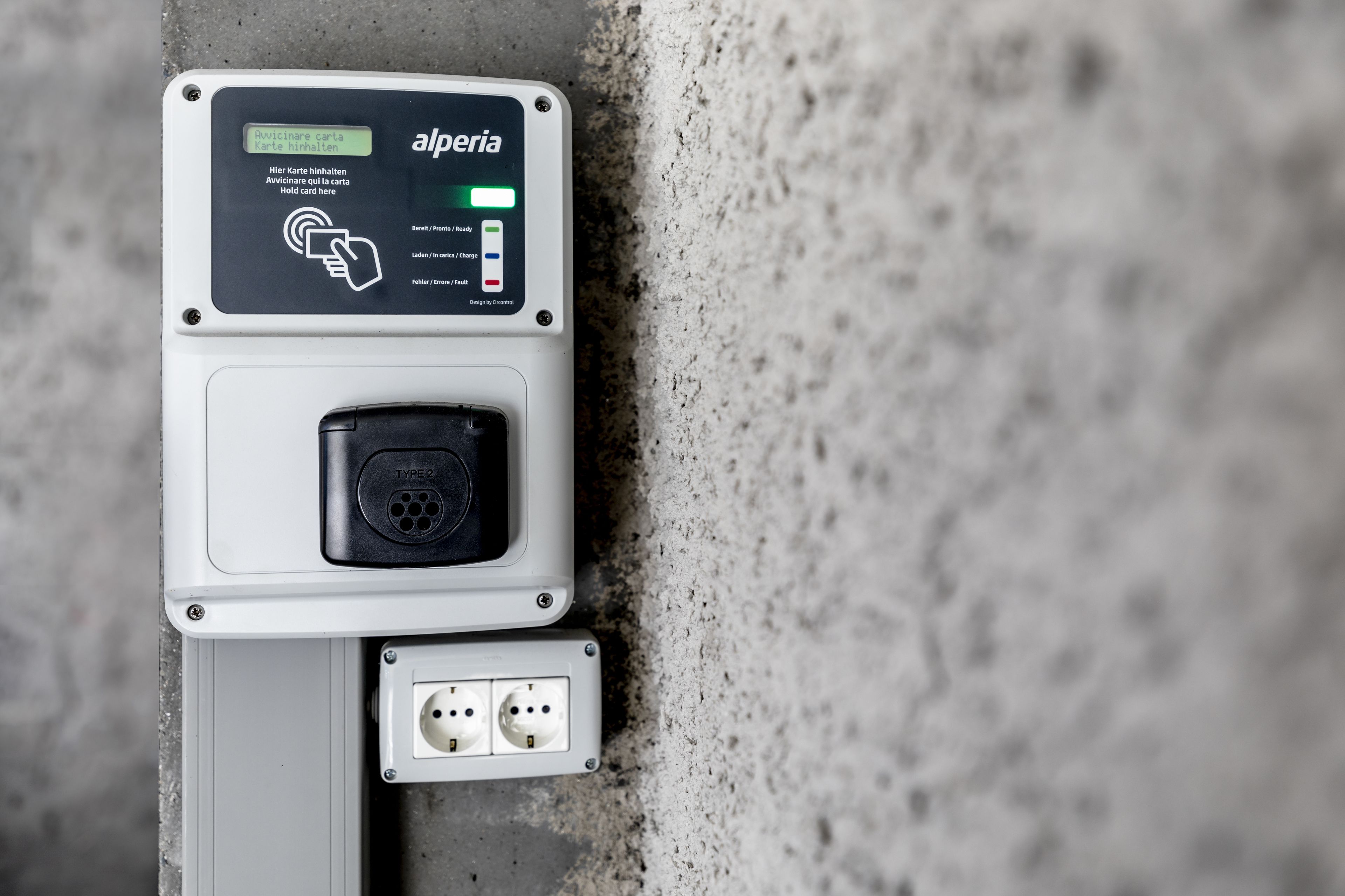 An electrical box with a label reading "alperia" and a Type 2 socket.