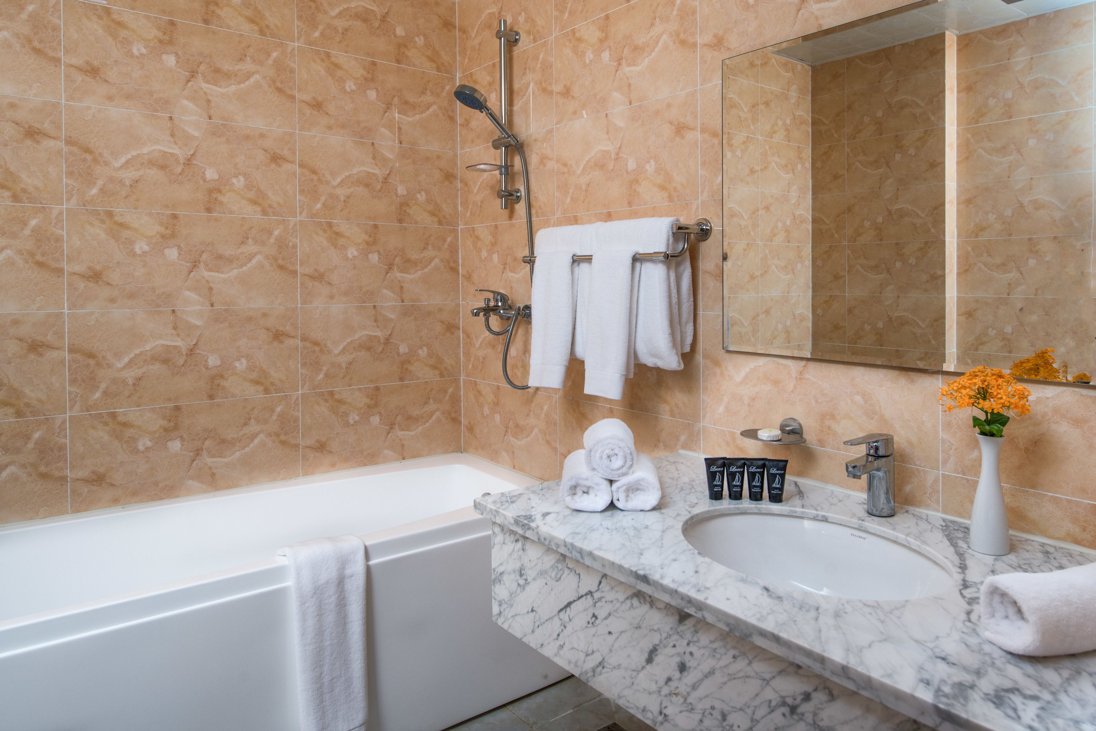 separate bathtub and shower, free toiletries, hair dryer, slippers