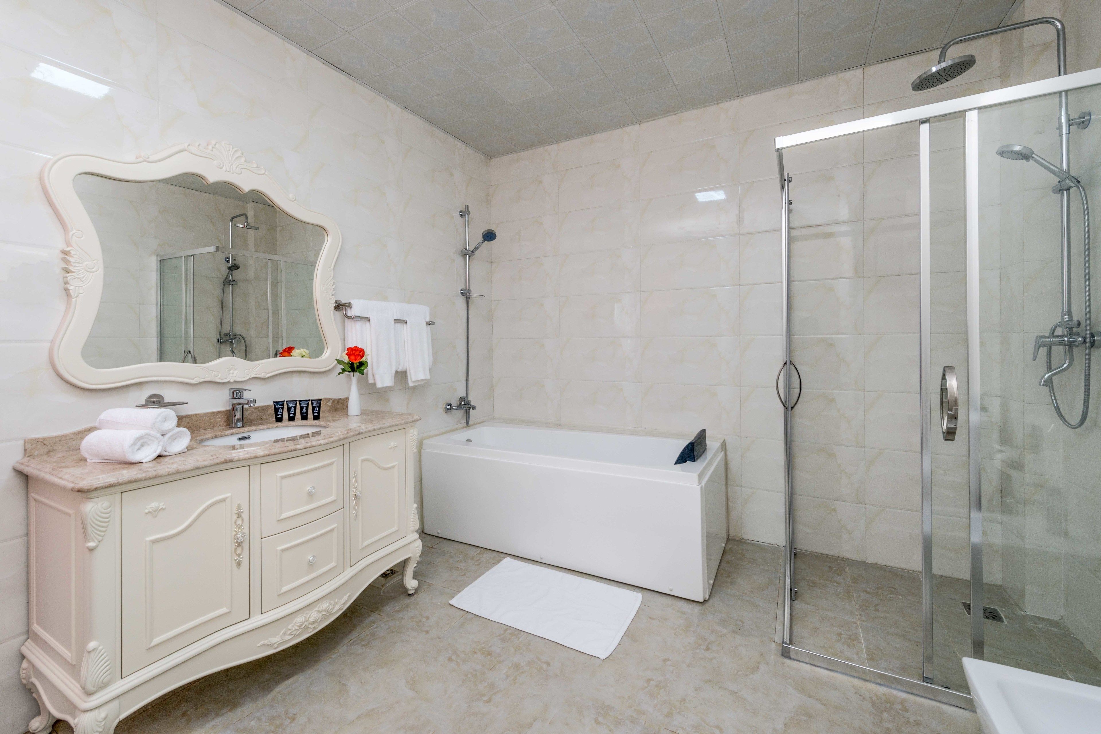 separate bathtub and shower, free toiletries, hair dryer, slippers