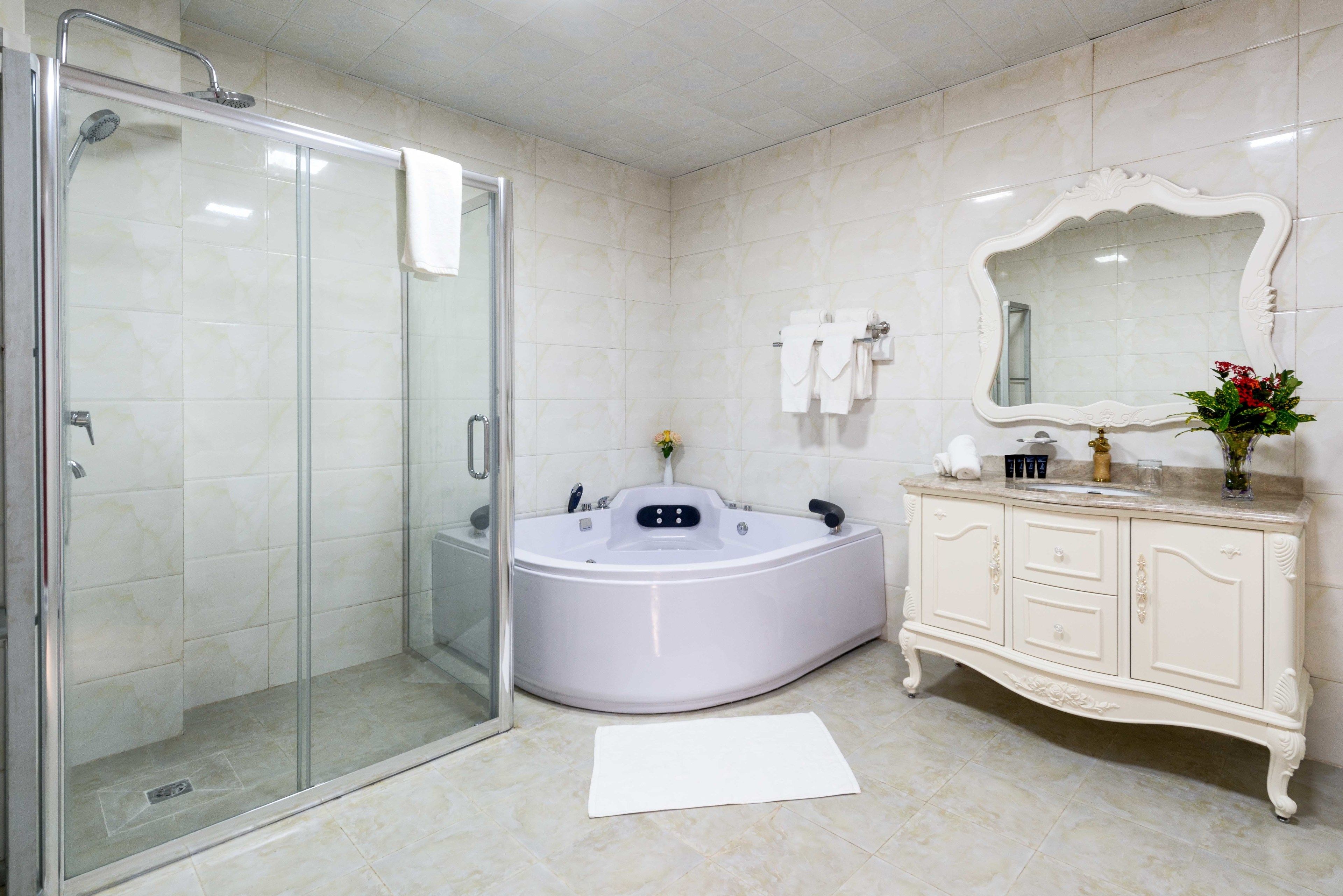 separate bathtub and shower, free toiletries, hair dryer, slippers