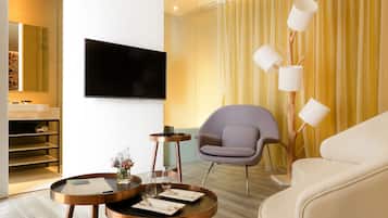Theme Room (Room Selected at Check-in) | Living area | 43-inch LCD TV with cable channels, TV