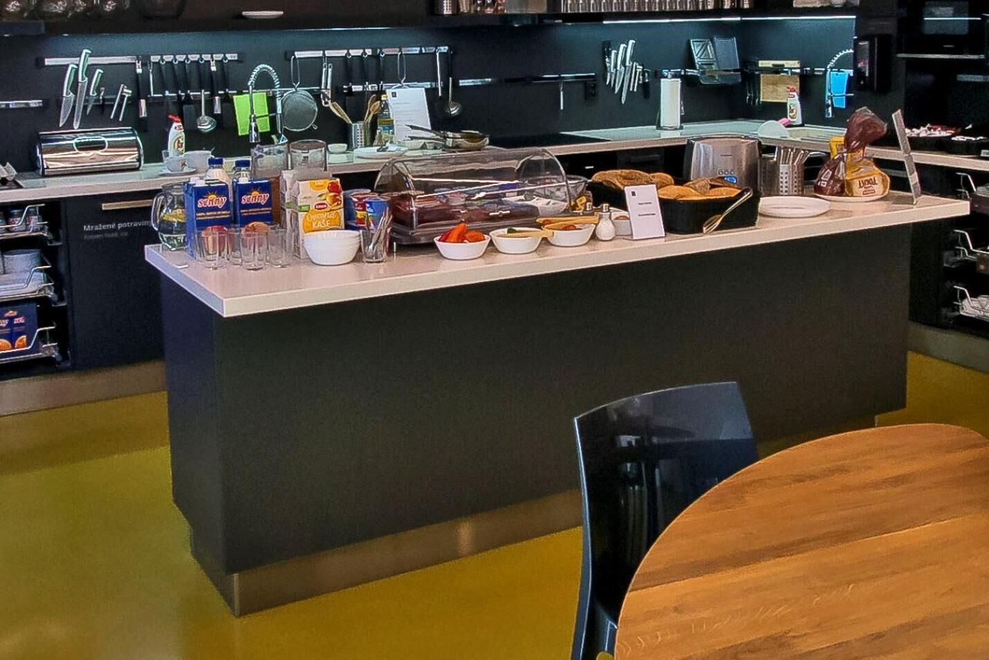A breakfast bar with various food items and condiments.