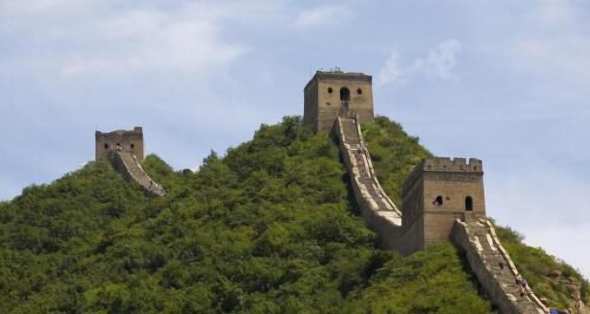 The Great Wall of China with watchtowers and steep sections.