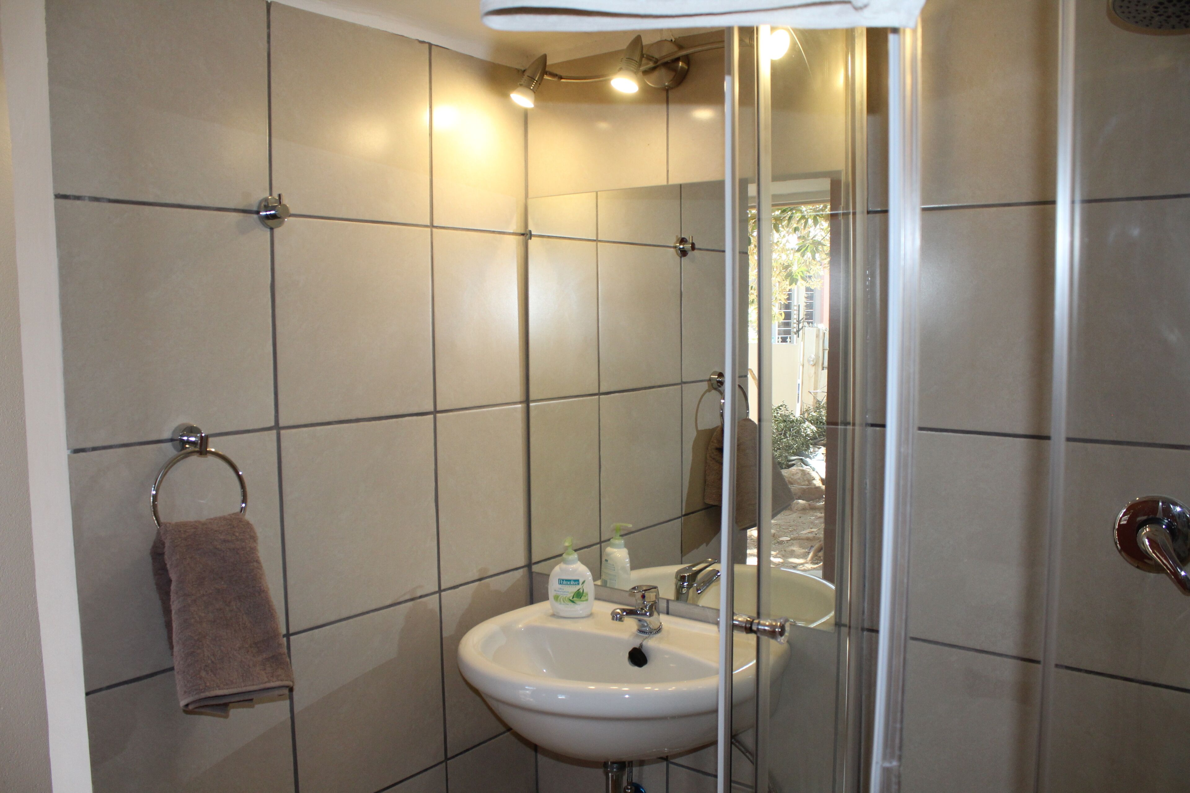 budget twin room | bathroom | shower, towels, soap, shampoo