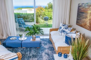 Deluxe Apartment, 1 Bedroom, Garden View, Mountainside | Living area | Flat-screen TV, DVD player, iPod dock, MP3 dock - Bay Reflections - Luxury Serviced Apartments (Cape Town)
