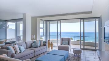 Luxury Apartment, 2 Bedrooms, Sea View, Mountainside | Living area | Flat-screen TV, DVD player, iPod dock, MP3 dock