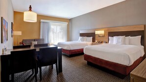 A hotel room with two beds, a desk, and a chair. - TownePlace Suites by Marriott Austin Round Rock (Austin)