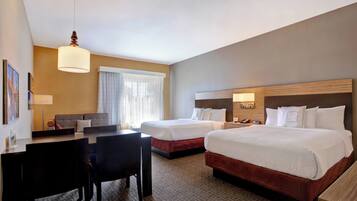 Hypo-allergenic bedding, desk, laptop workspace, blackout drapes