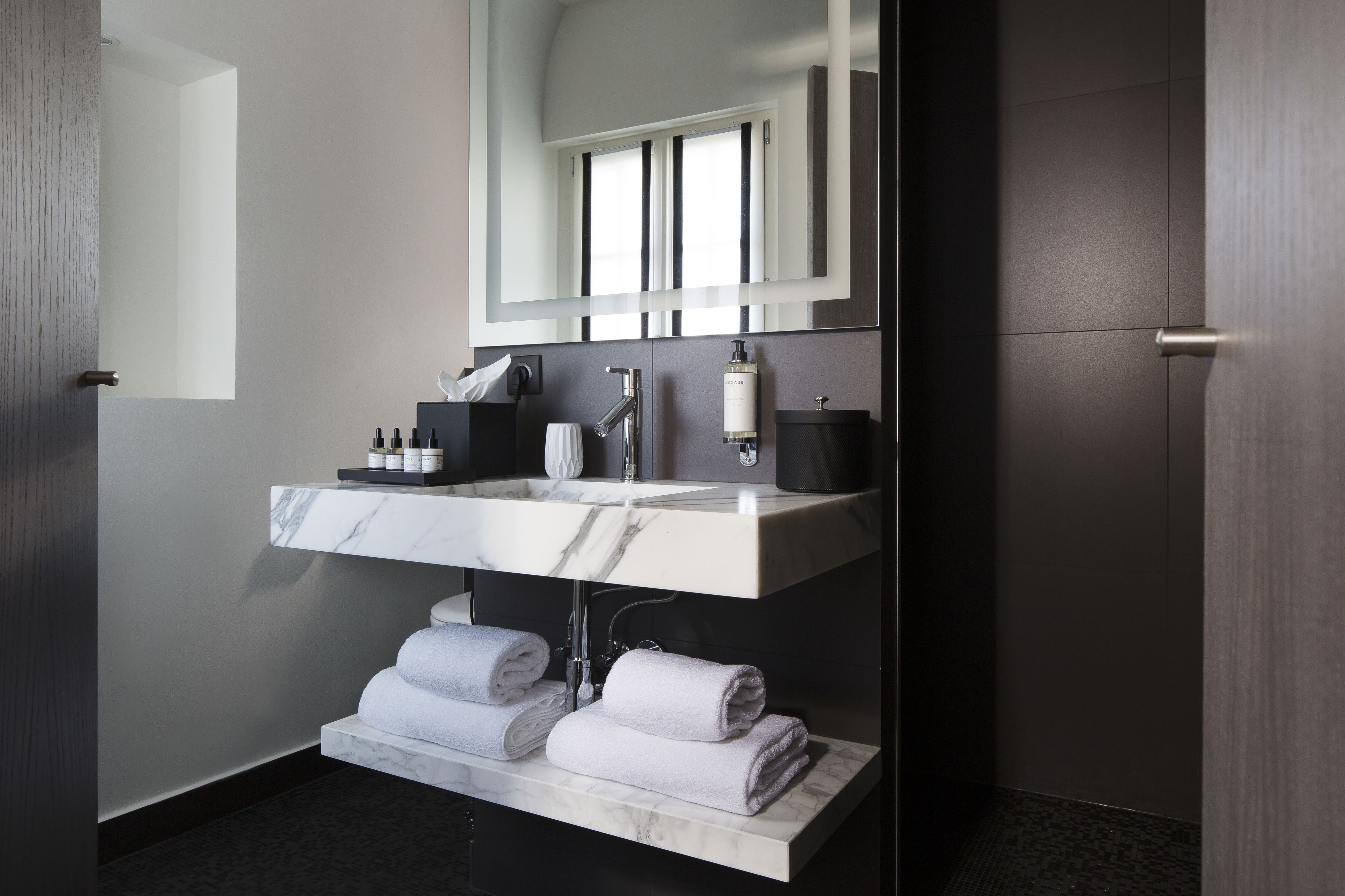 deluxe double room | bathroom | shower, rainfall showerhead, designer toiletries, hair dryer