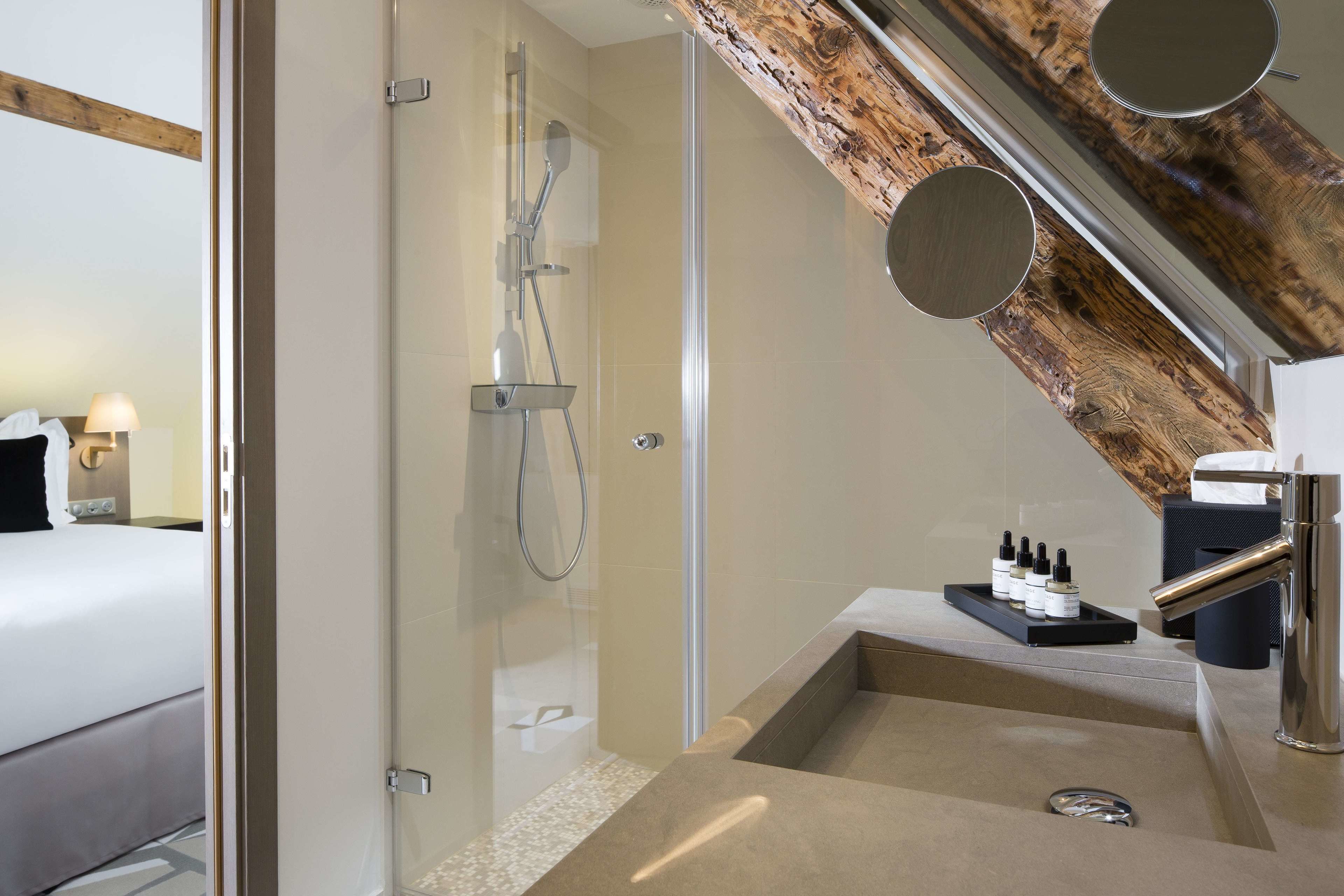 deluxe double room | bathroom | shower, rainfall showerhead, designer toiletries, hair dryer