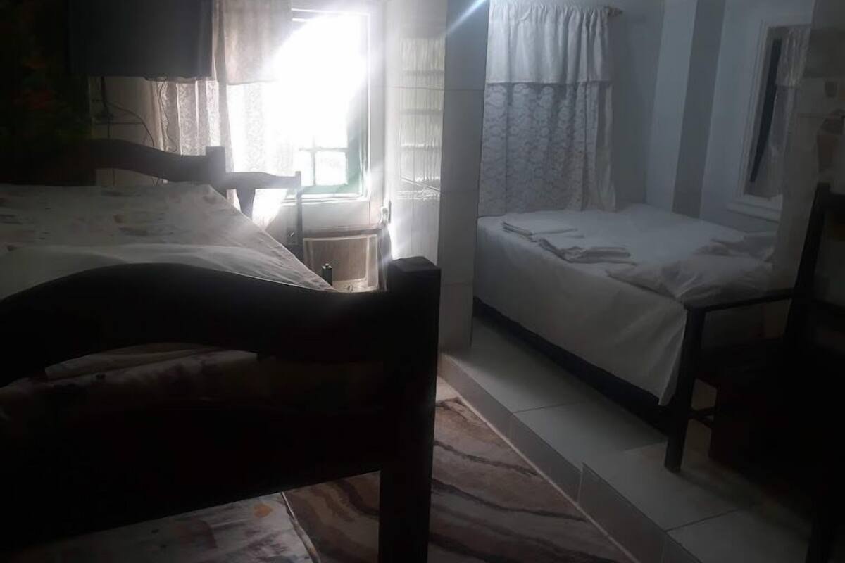 Family Quadruple Room | Living area | TV