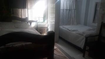 Family Quadruple Room | Living area | TV
