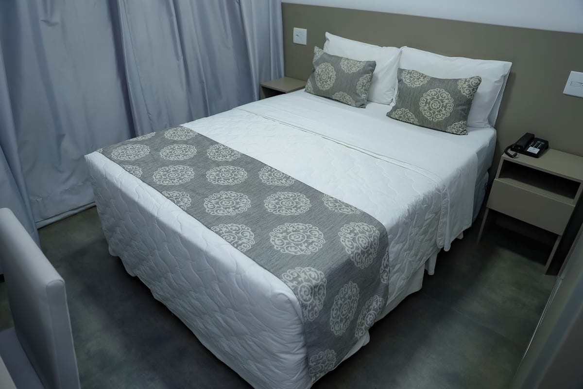 Deluxe Double Room Single Use | Minibar, in-room safe, blackout drapes, soundproofing