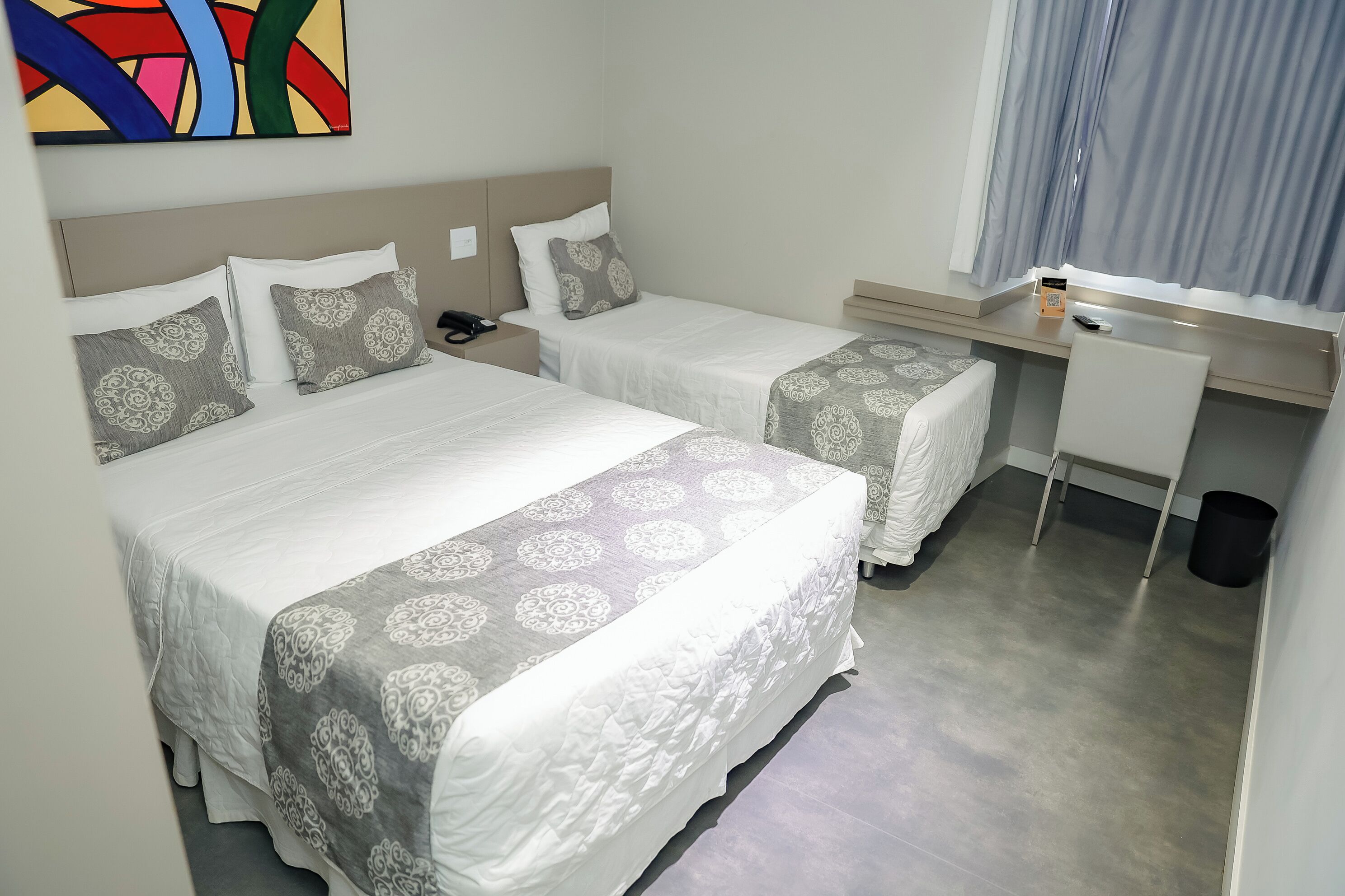 Family Triple Room | Minibar, in-room safe, blackout drapes, soundproofing