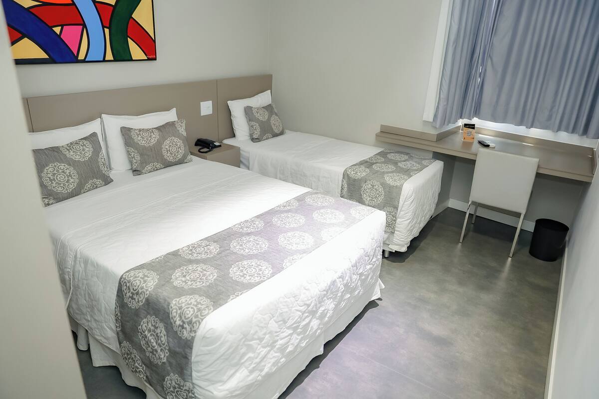 Family Triple Room | Minibar, in-room safe, blackout drapes, soundproofing