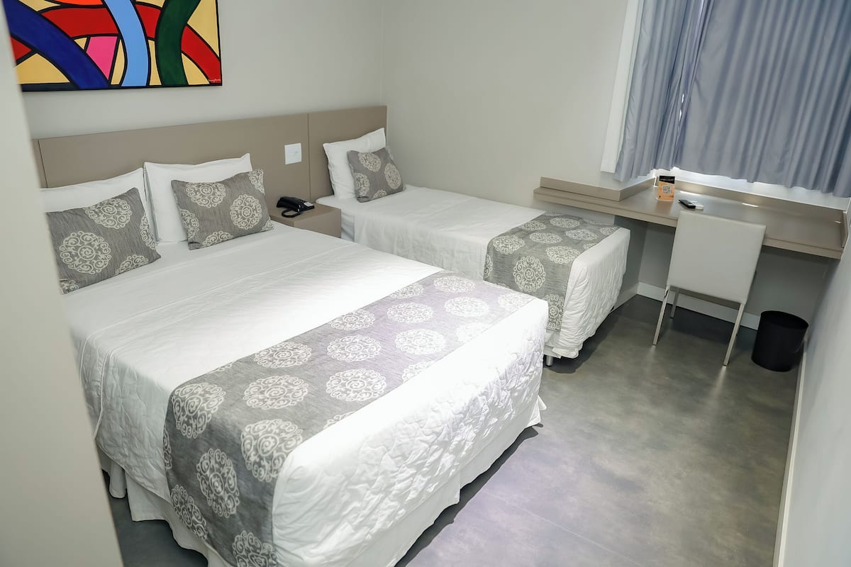 Family Triple Room | Minibar, in-room safe, blackout drapes, soundproofing