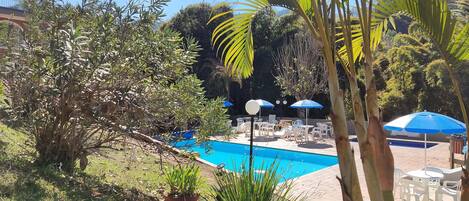 Outdoor pool, pool umbrellas, sun loungers