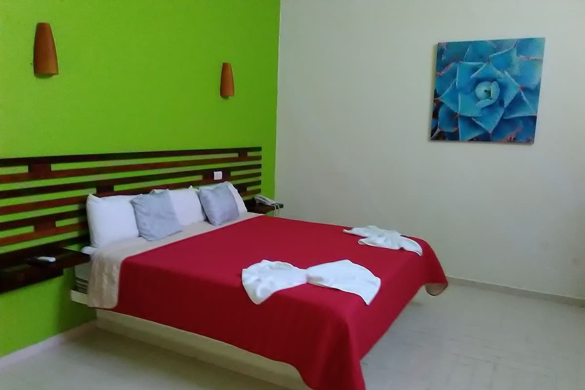 Room, 1 King Bed | Iron/ironing board, free cribs/infant beds, rollaway beds, free WiFi