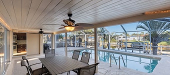 Updated home on the canal, heated in ground pool, boat dock, bikes!