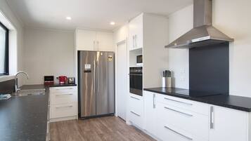 Villa, 4 Bedrooms | Private kitchen | Full-sized fridge, microwave, oven, stovetop