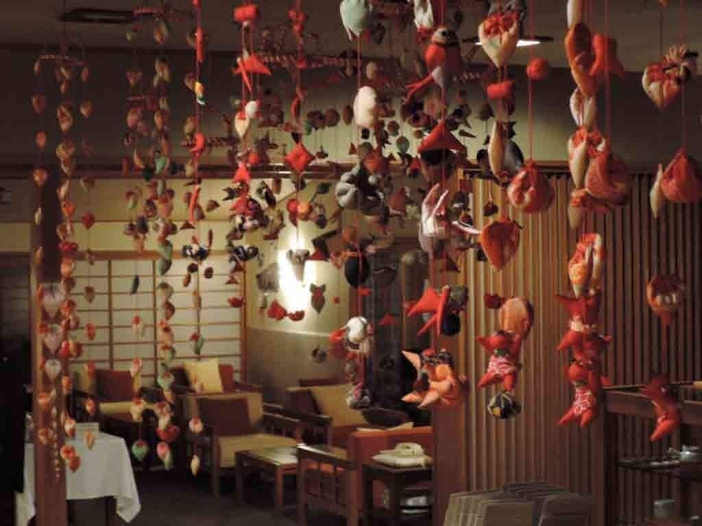 A room with multiple hanging decorations and a traditional Japanese-style interior.