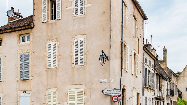 A historic building with multiple windows and a traditional facade.