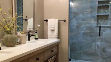 Combined shower/tub, hair dryer, towels, soap