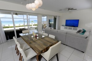 Great dining table and 75' smart TV 