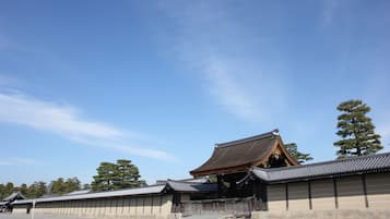 A traditional Japanese building with a curved roof and wooden structures.